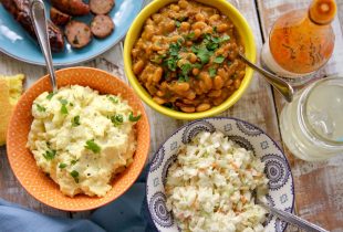 3 bowls of baked beans, coleslaw and potato salad
