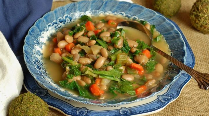 a plate of creole pinto beans and greens soup