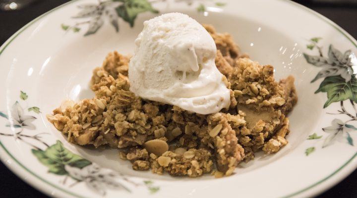 a plate of bean cobbler topped with vanilla ice cream