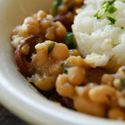 a close up of south louisiana style white beans and rice