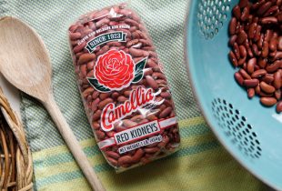 red bean packaging with colander and wooden spoon