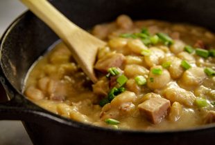 a cast iron dutch oven full of simple southern lima beans