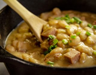 a cast iron dutch oven full of simple southern lima beans