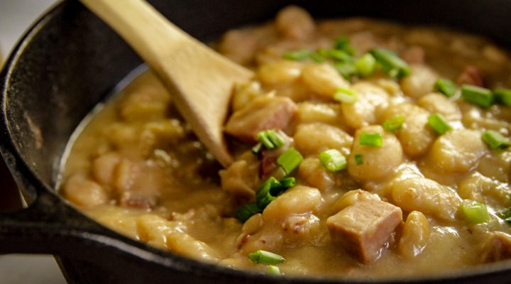 a cast iron dutch oven full of simple southern lima beans