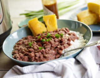 Plated red beans and rice dish with cornbread on the side.