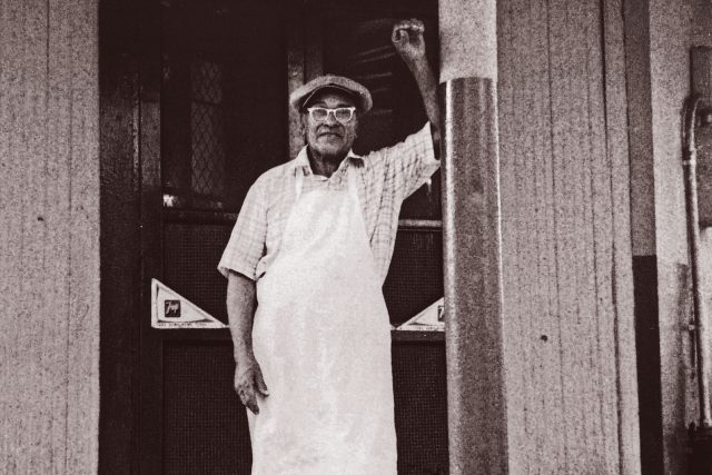 Buster Holmes in front of his restaurant 