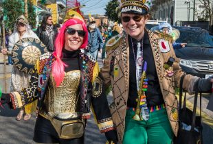 2 people dressed for the mardi gras dead beans parade