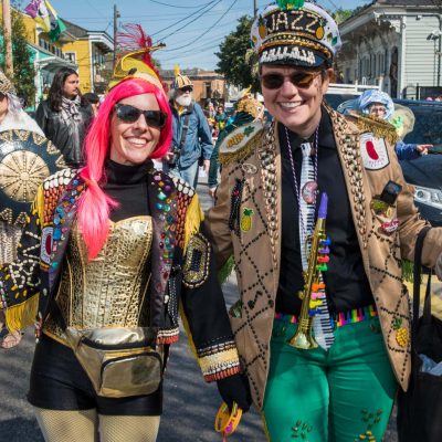 2 people dressed for the mardi gras dead beans parade