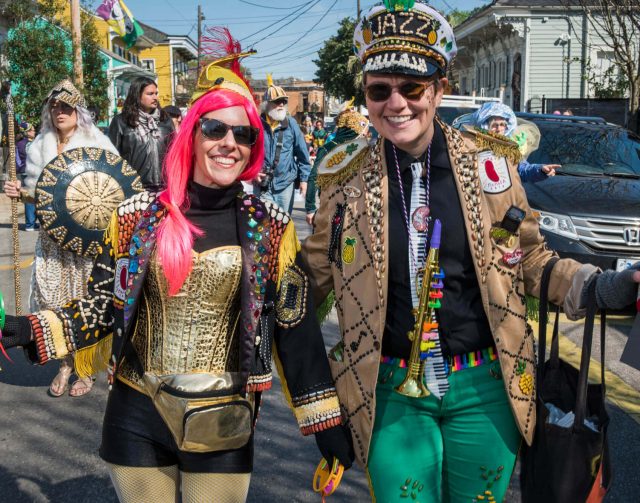 2 people dressed for the mardi gras dead beans parade