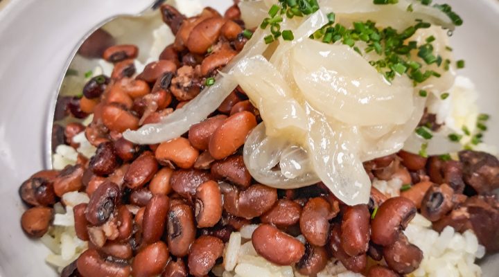 bowl of Chef Jenn's Smoky Field Peas with Brown Butter Onions and Rice