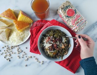 a bowl of Potlikker next to a package of camellia brand black eyes and a side of cornbread