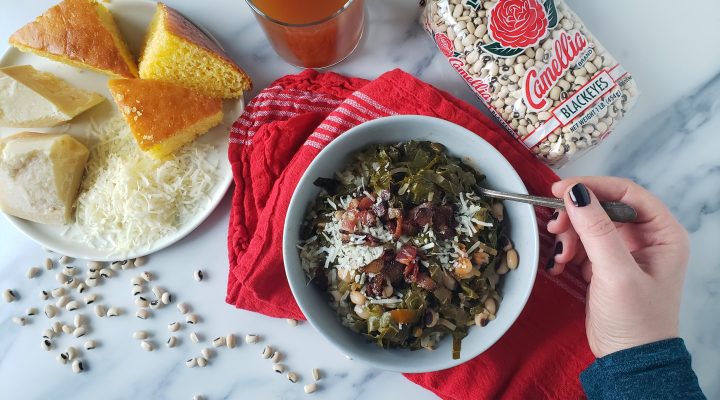 a bowl of Potlikker next to a package of camellia brand black eyes and a side of cornbread