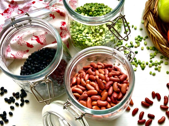 Dried beans in jars on a table