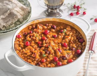 a dutch oven of cranberry bbq baked beans