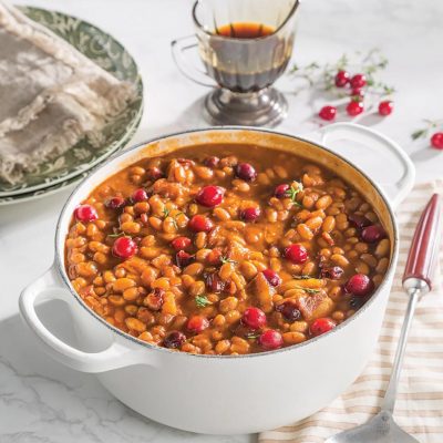 a dutch oven of cranberry bbq baked beans