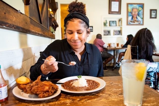 Customer enjoying a bowl of red beans and rice