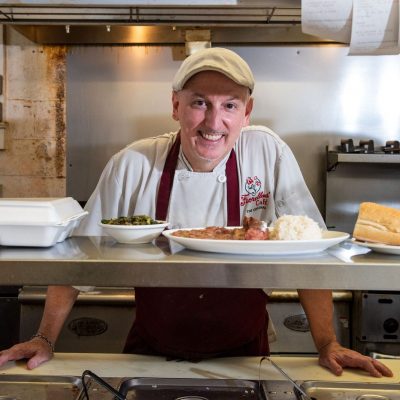 chef at fiorellas posing with his creations