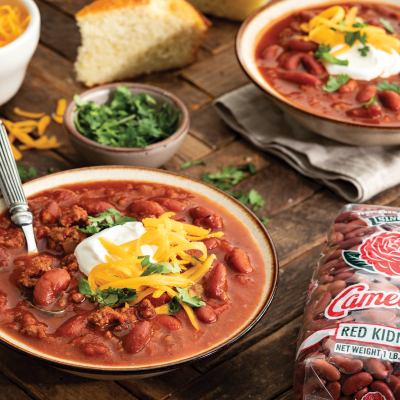 2 bowls of Old Fashioned Chili with Beans next to a pakcage of camellia brand red kidneys