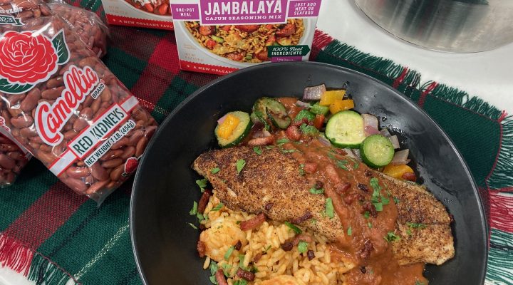 pan with completed, cooked blackened gulf fish with red bean sauce rests on a table surrounded by Camellia Brand products