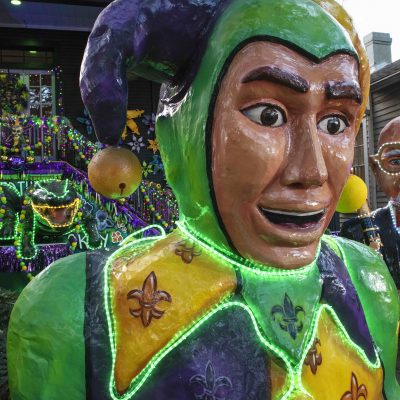 jester house float during a mardi gras parade in new orleans