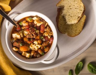 a bowl of kid friendly instant pot pasta fagioli with a side of bread