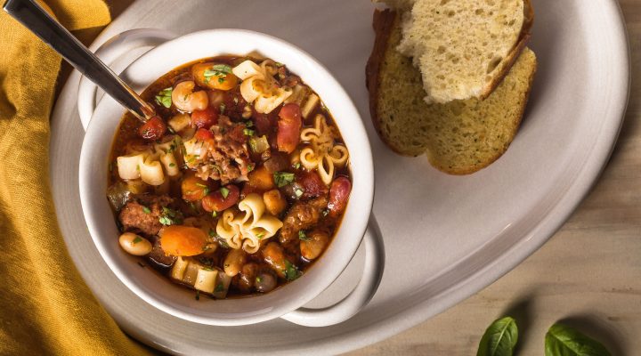 a bowl of kid friendly instant pot pasta fagioli with a side of bread