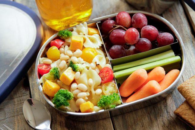 Kid-Friendly Pasta & White Bean Salad served with grapes, carrots and celery.