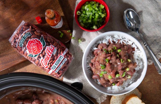 Camellia Brand packaged dried red beans and a bowl of cooked red beans and rice