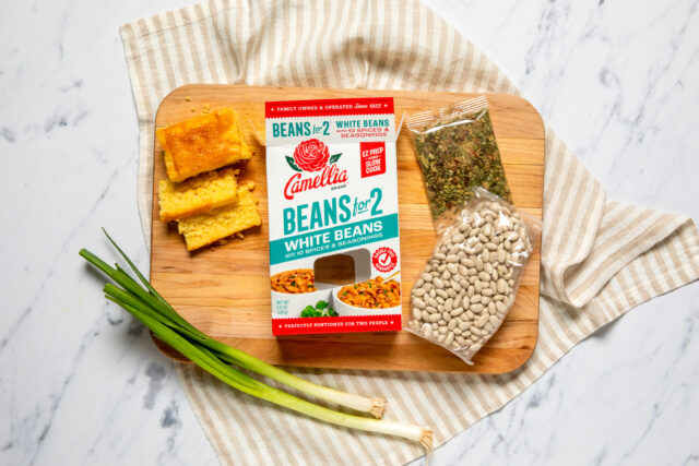 White Beans for 2 Box next to cornbread and green onion