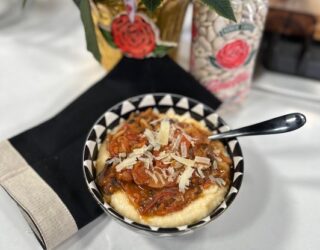 Lima Bean Ragout with Cheese Grits in a bowl next to bag of beans