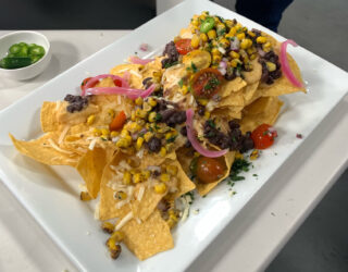 plate of Chef Jamie nachos with white bean cheese