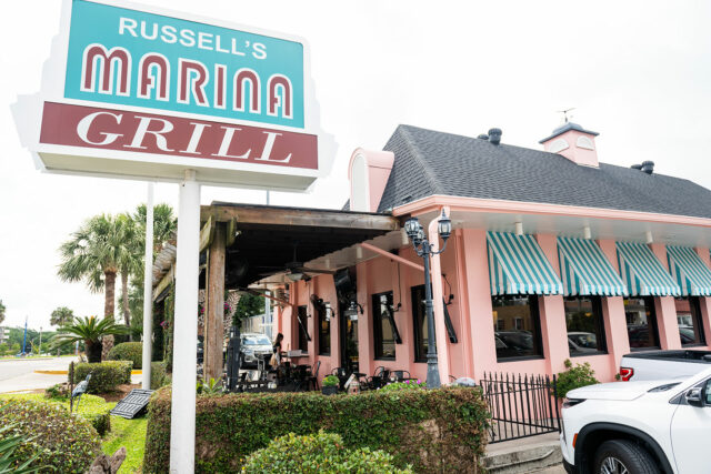 Restaurant sign at Russells Marina Grill